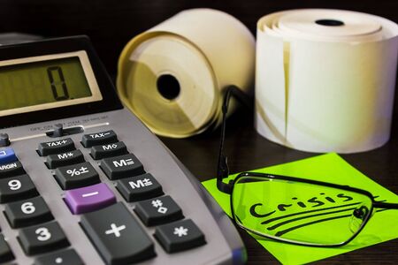 green sticker the Crisis lies on the Deskの写真素材