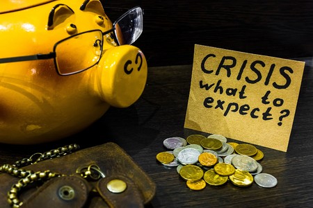 Piggy bank and purse are on the tableの写真素材