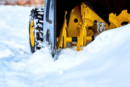 Close-up of the snowthrower ready for cleaning the snow in the winter after a snowstormの写真素材