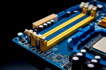 Memory ports closeup on motherboard on black background. Can be used as a background