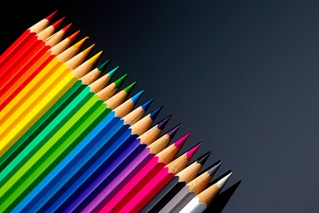 bright colored pencils laid out on the table. ready for operation. Can be used as a background...
