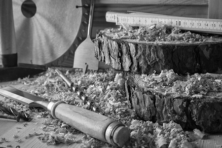 Shaving plane wooden shavings hammer flat chisels construction concept.