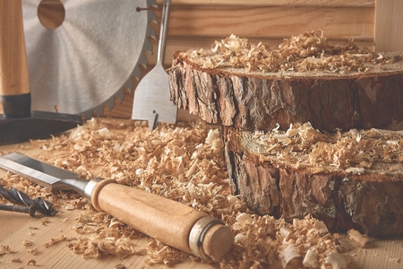Shaving plane wooden shavings hammer flat chisels construction concept.