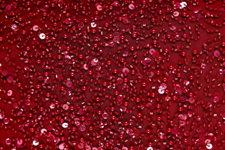 Fabric with sequins and sequins of bright colors. Fashion glitter fabric, sequins. can be used as backgroundの写真素材
