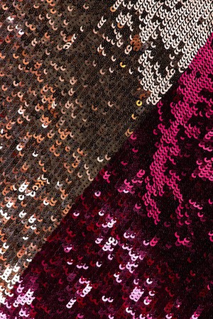 Fabric with sequins and sequins of bright colors. Fashion glitter fabric, sequins. can be used as backgroundの写真素材