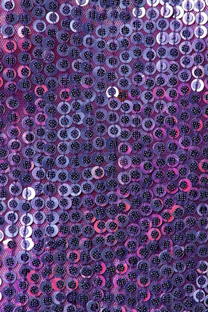 Fabric with sequins and sequins of bright colors. Fashion glitter fabric, sequins. can be used as backgroundの写真素材