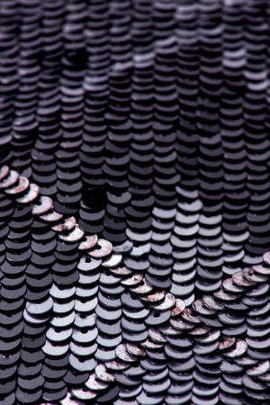 Fabric with sequins and sequins of bright colors. Fashion glitter fabric, sequins. can be used as backgroundの写真素材