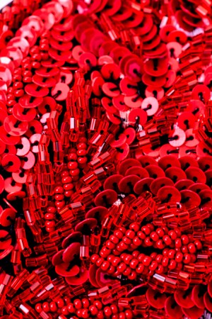 Fabric with sequins and sequins of bright colors. Fashion glitter fabric, sequins. can be used as backgroundの写真素材