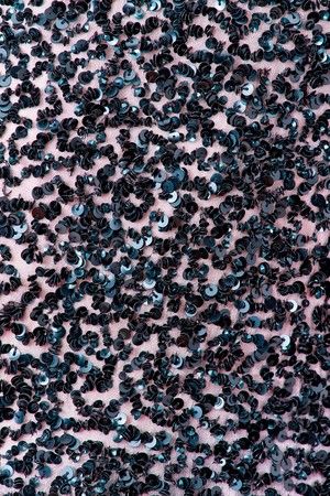 Fabric with sequins and sequins of bright colors. Fashion glitter fabric, sequins. can be used as backgroundの写真素材