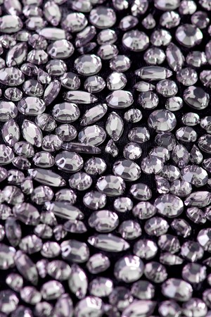 Fabric with sequins and sequins of bright colors. Fashion glitter fabric, sequins. can be used as backgroundの写真素材