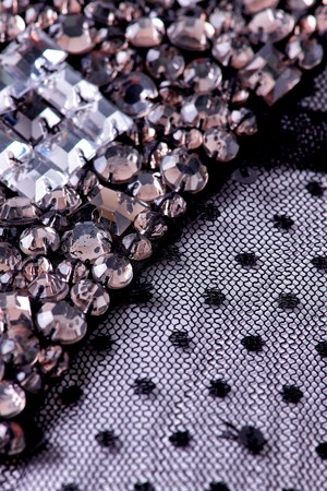 Fabric with sequins and sequins of bright colors. Fashion glitter fabric, sequins. can be used as backgroundの写真素材