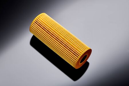 car engine oil filter on dark backgroundの写真素材