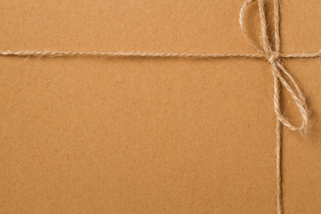 Brown shipping parcel tied with twine