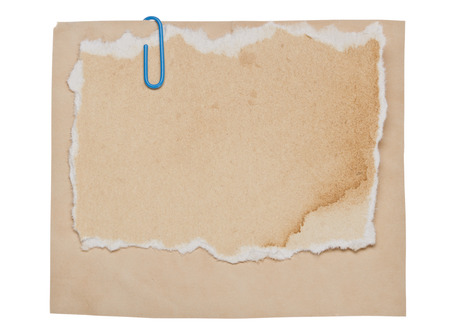Old paper with clip isolated on white backgroundの写真素材