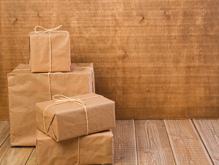 Parcel wrapped in brown paper and tied with rough twine