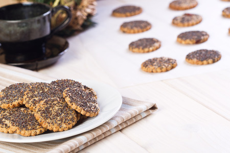 Cookies with poppy seed in white plateの写真素材