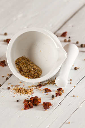 Ceramic Mortar with Pestle and fresh spicesの写真素材