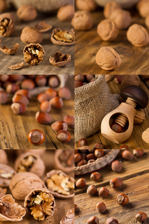 Walnuts and hazelnuts  on old wooden tableの写真素材