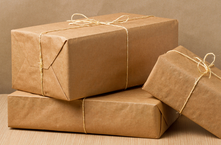 Parcel wrapped in brown paper and tied with rough twineの写真素材