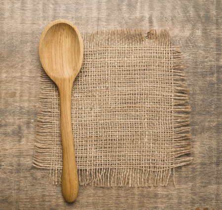 Wooden spoon on rustic wooden tableの写真素材