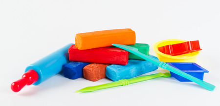 Colorful plasticine and tools on white backgroundの写真素材