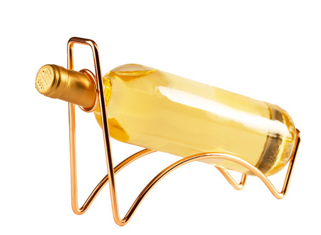 White wine bottle  on a metal wine rack isolated on whiteの写真素材