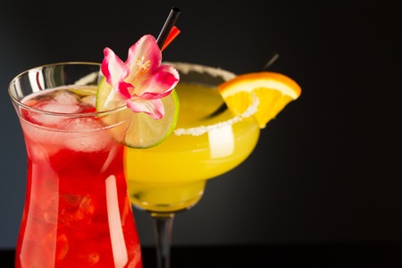 Tropical cocktails garnished with  citrus sliceの写真素材