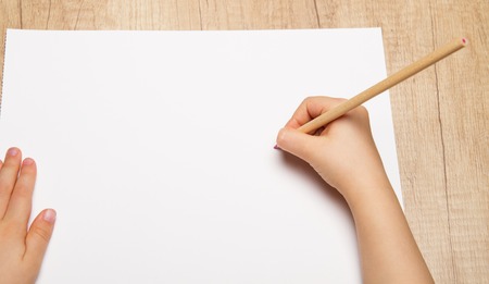 Hand of child drawing by colour pencilの写真素材