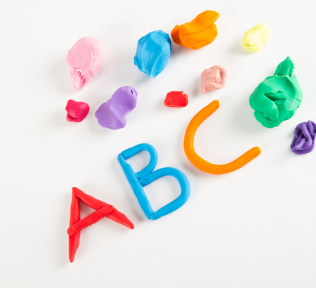 Colorful plasticine letters on whiteの写真素材