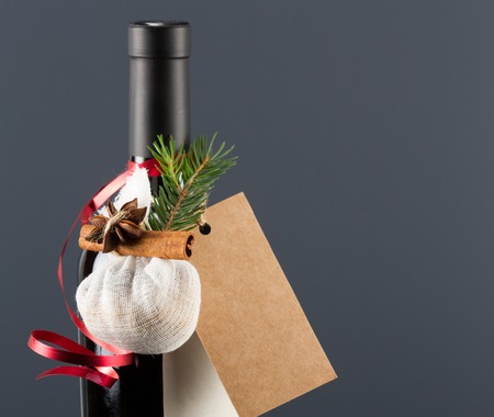 Red wine bottle and bag of spices for mulled wineの写真素材
