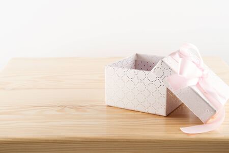 Empty gift box on wooden tableの写真素材