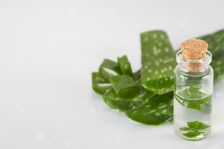 Aloe vera juice and fresh aloe vera leavesの写真素材