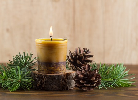 Burning handmade beewax candle with cinnamon.Advent wreathの写真素材