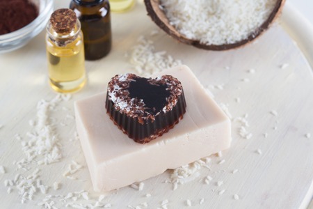 Handmade soap, essential oils on wooden tableの写真素材