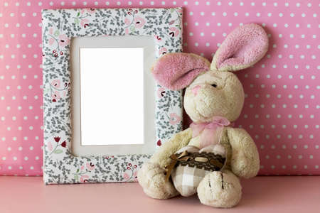 Photo frame with teddy rabbit and gift boxの写真素材