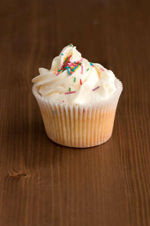 Handmade Cake with cream on a wooden table. Treats for the holidayの写真素材