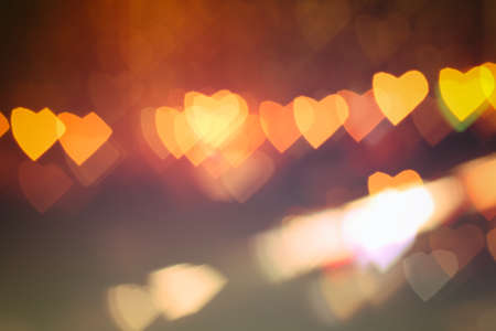 Bokeh in the form of heart on a black and blue background. Gradiebt.の写真素材