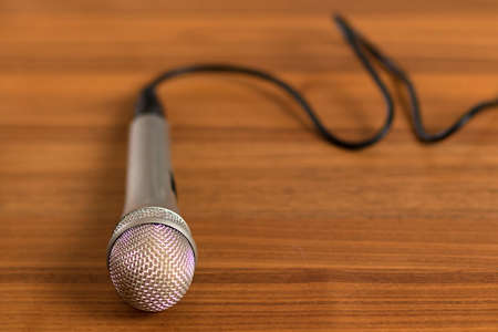 closed up studio microphone on wooden tableの写真素材