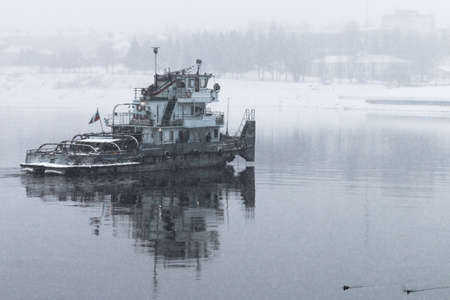 Tug boat on the river in the snow. Russia. Volga river. Winter.の写真素材