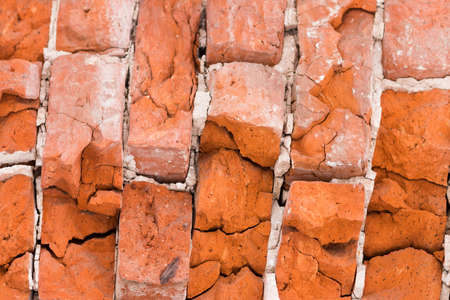 Texture of an old red brick. Ancient bricks chopped.の写真素材