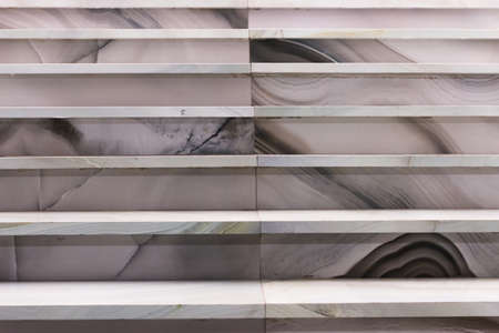 Marble staircase. Graphically marble figure. Frontal view of the ladder.