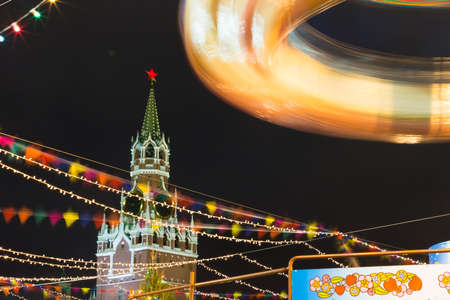 Christmas lighting in Moscow. Fair on the Red Square. Festivities. Christmas tree. Twisting...