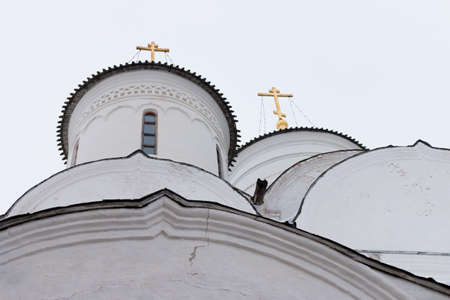Spaso-Priluckiy monastery in winter. Spassky Cathedral. View of the domes and golden crosses. Detail of facade. Vologda. Travel north Russia. Ancient architecture. Saviour Priluki Monastery in winter frosty dayの写真素材