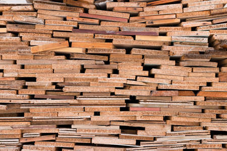Boards stacked pile. Picturesque wooden texture. Ends of the boards. Stack of planks.の写真素材