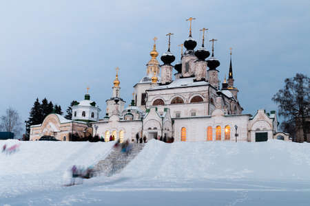 Night winter view of historical centre of Veliky Ustyug, Russia. Cathedral Court. Uspensky Cathedral, Church of the Epiphany. Evening view. Festivities. Travel to the North of Russia.の写真素材