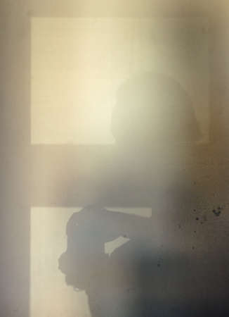 Shadow of unrecognizable,unknown photographer with camera on the white wall.
Textured, rough,grunge white background. Shadow from the photographer on a concrete wall. Light from the window.の写真素材