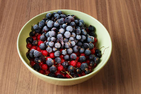 Frozen currant berries. Frozen berries - black currant and red currant. Top view. Macro.の写真素材