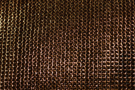 Texture of the chain mail. Gold weaving of chain mailの写真素材