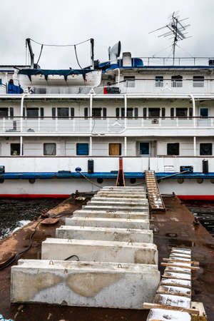 Moored river ship. The passenger cruise ship is moored to the Moscow River embankment. Wintering ships on the river. Moscow. Russia.の写真素材