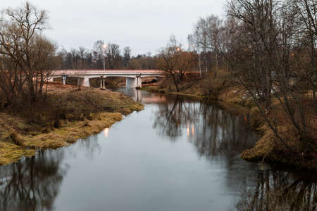 Autumn evening landscape with Istra river and car bridge. Moscow region, Russia.の写真素材